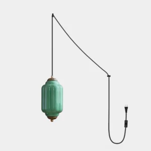 Eloise colored glass plug-in pendant light with cyan lantern shade, antique brass hardware, and braided cord - studio shot