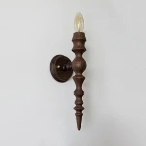 Eloise wooden candlestick wall lamp three-quarter side view showing carved turned wood detail