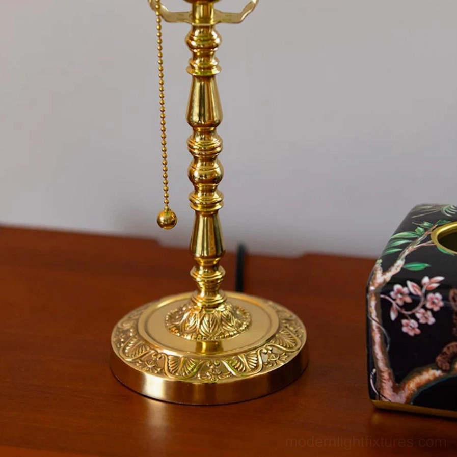 Elowen table lamp base and column detail showing turned brass construction and weight