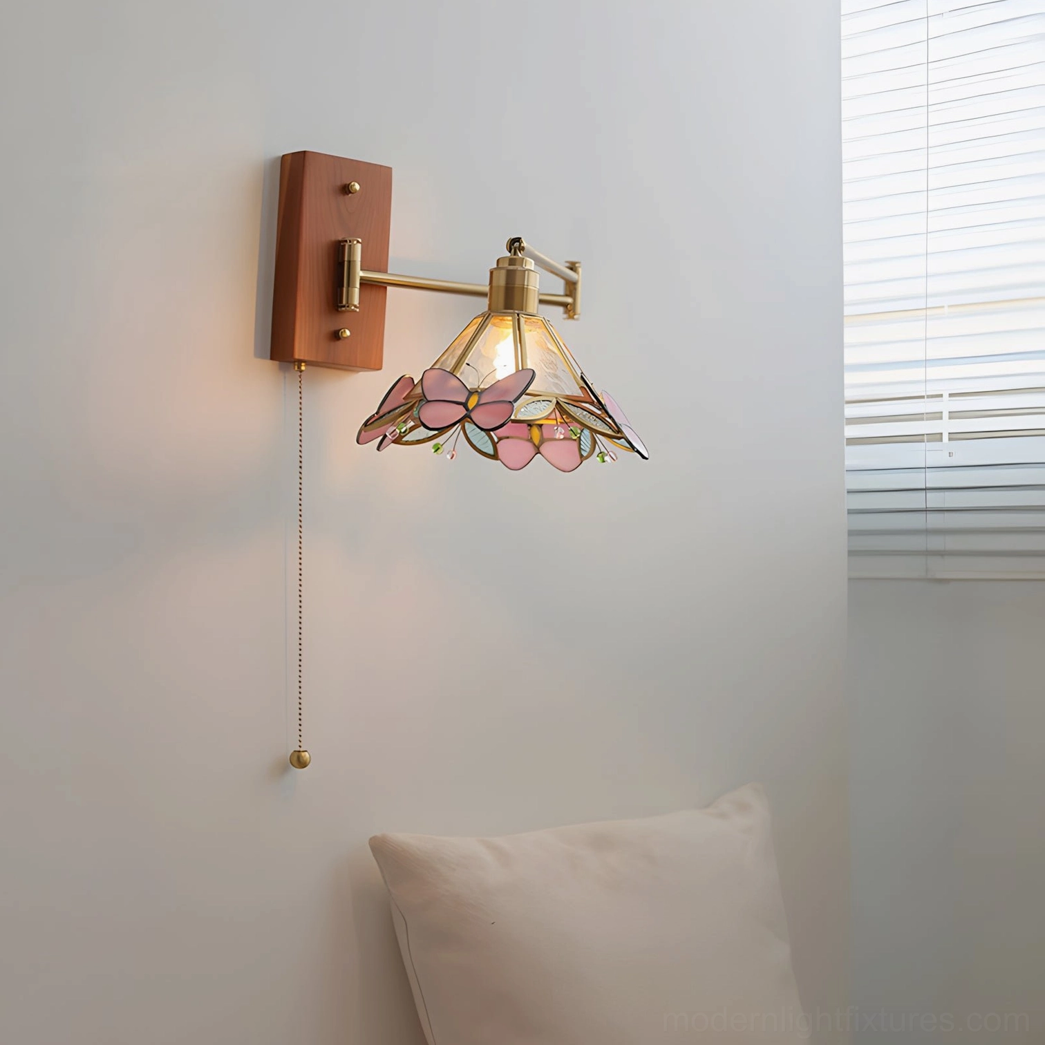 Elowen Petal Wall Sconce side close-up detail view, pink butterfly stained glass shade with wood-brass structure and pull chain