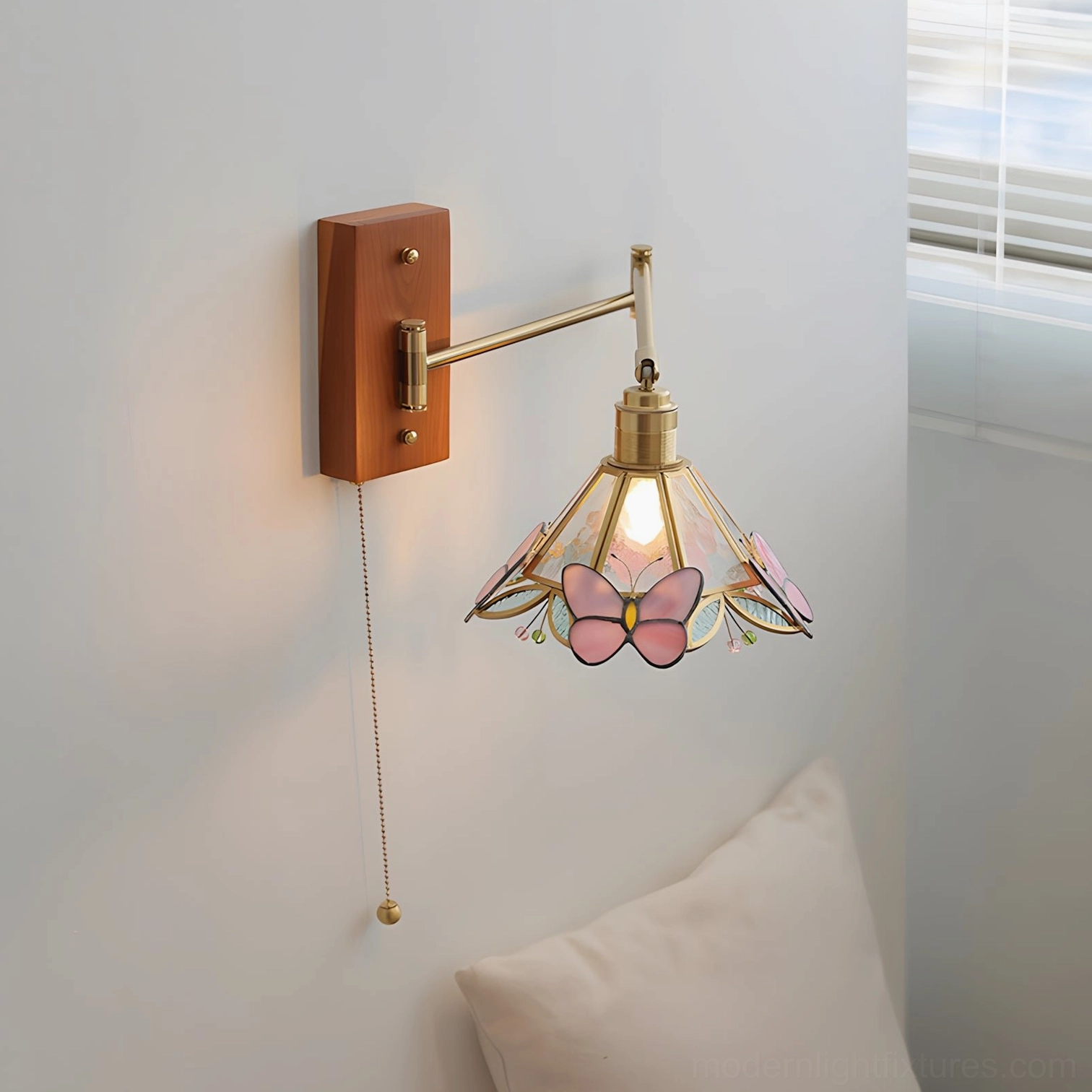 Elowen Petal Wall Sconce front close-up shot, pink butterfly stained glass shade with warm vintage wood-brass hardware aesthetic