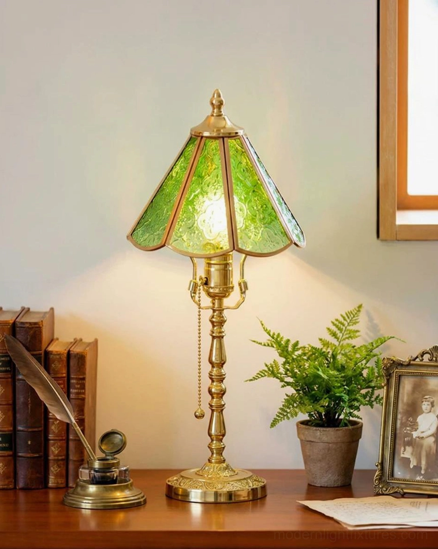 Lit Elowen vintage stained glass lamp glowing in home study with brass ornaments and potted plants