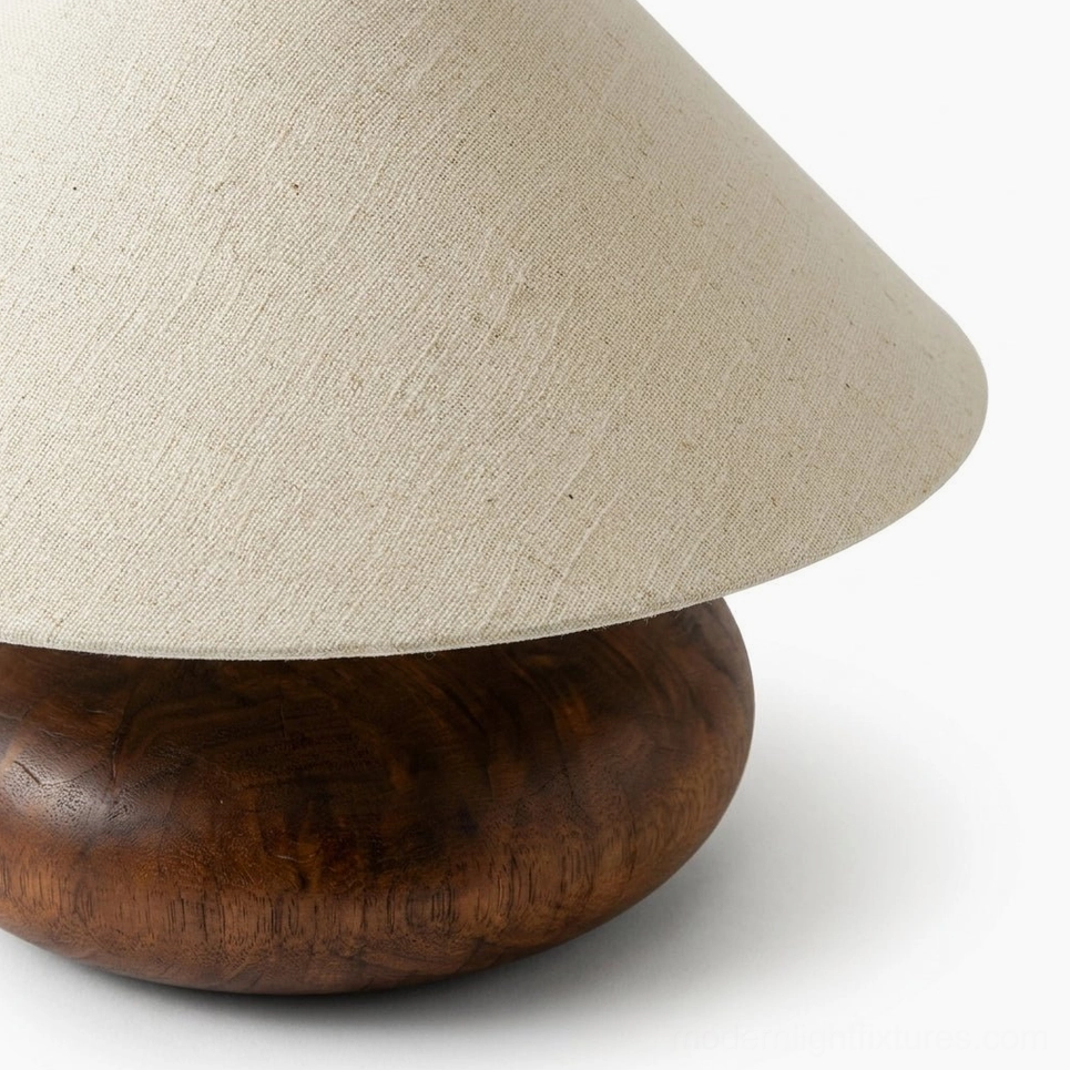 Close-up detail view of Elowen lamp showing natural linen fabric texture and solid wood grain walnut base
