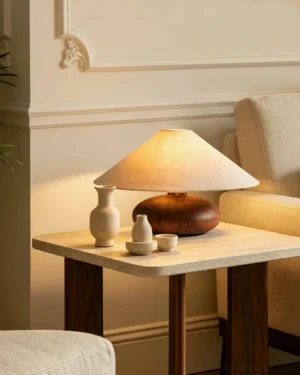 Elowen accent table lamp styled on French living room side table with warm ambient lighting and ceramic decor