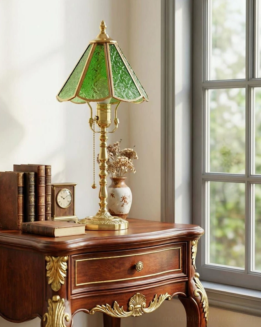 Elowen brass and green glass lamp creating warm ambient lighting in cozy home interior scene
