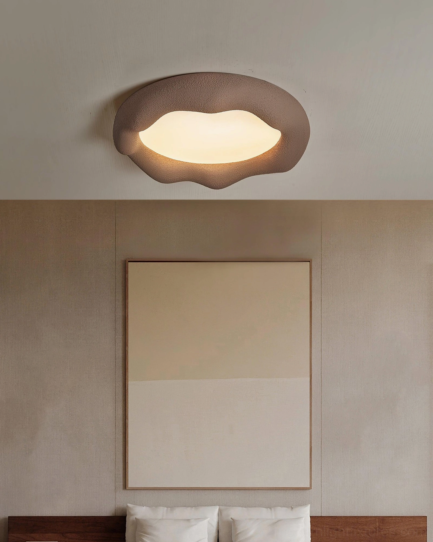 Dark brown cloud ceiling light on minimalist bedroom accent wall with warm glowing panel