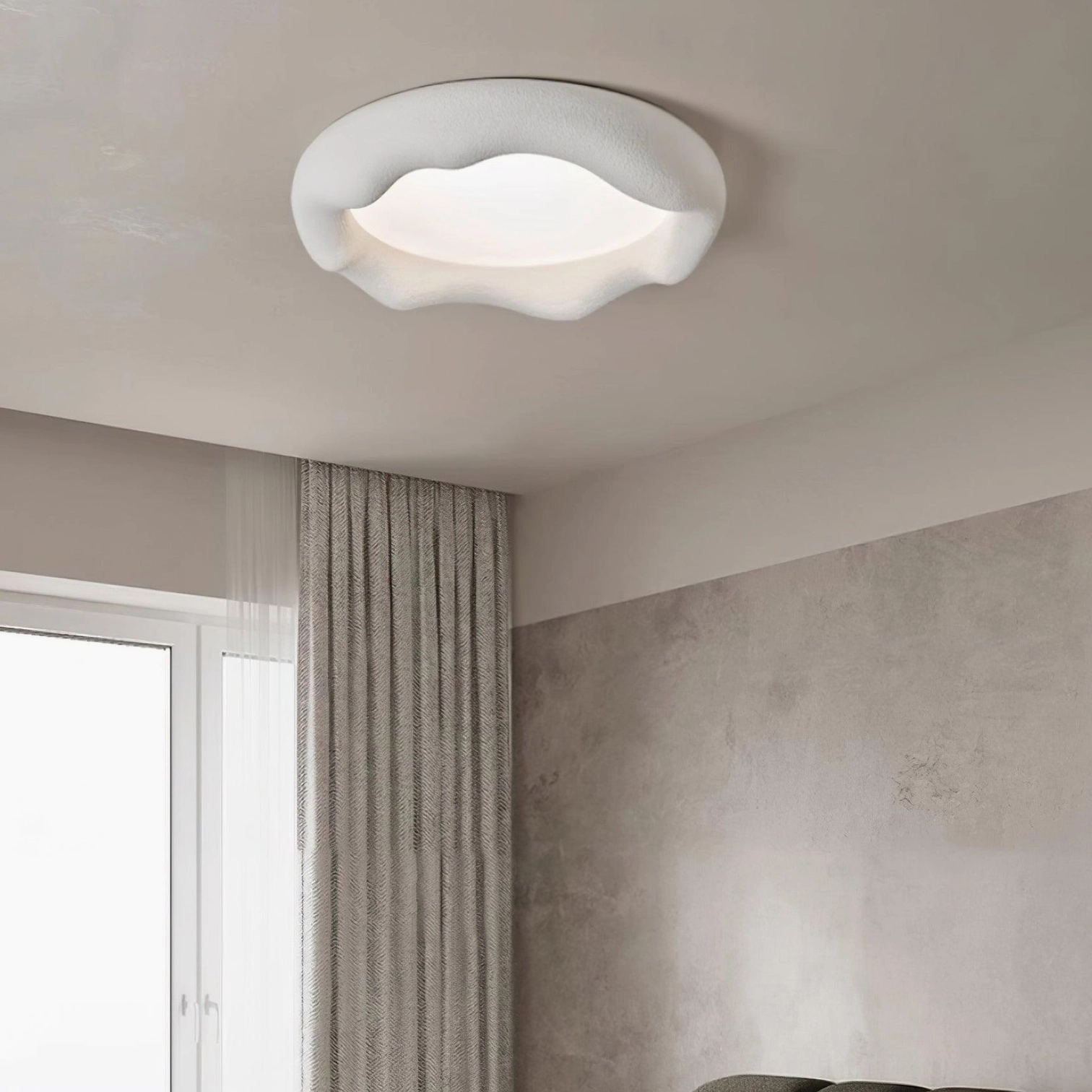 White wavy cloud ceiling light in minimalist bedroom corner with smooth matte finish warm LED