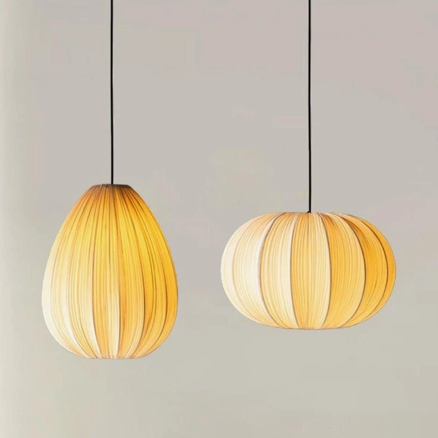 Two Elunor pendant lights in warm cream - pumpkin shape and teardrop shape, studio display