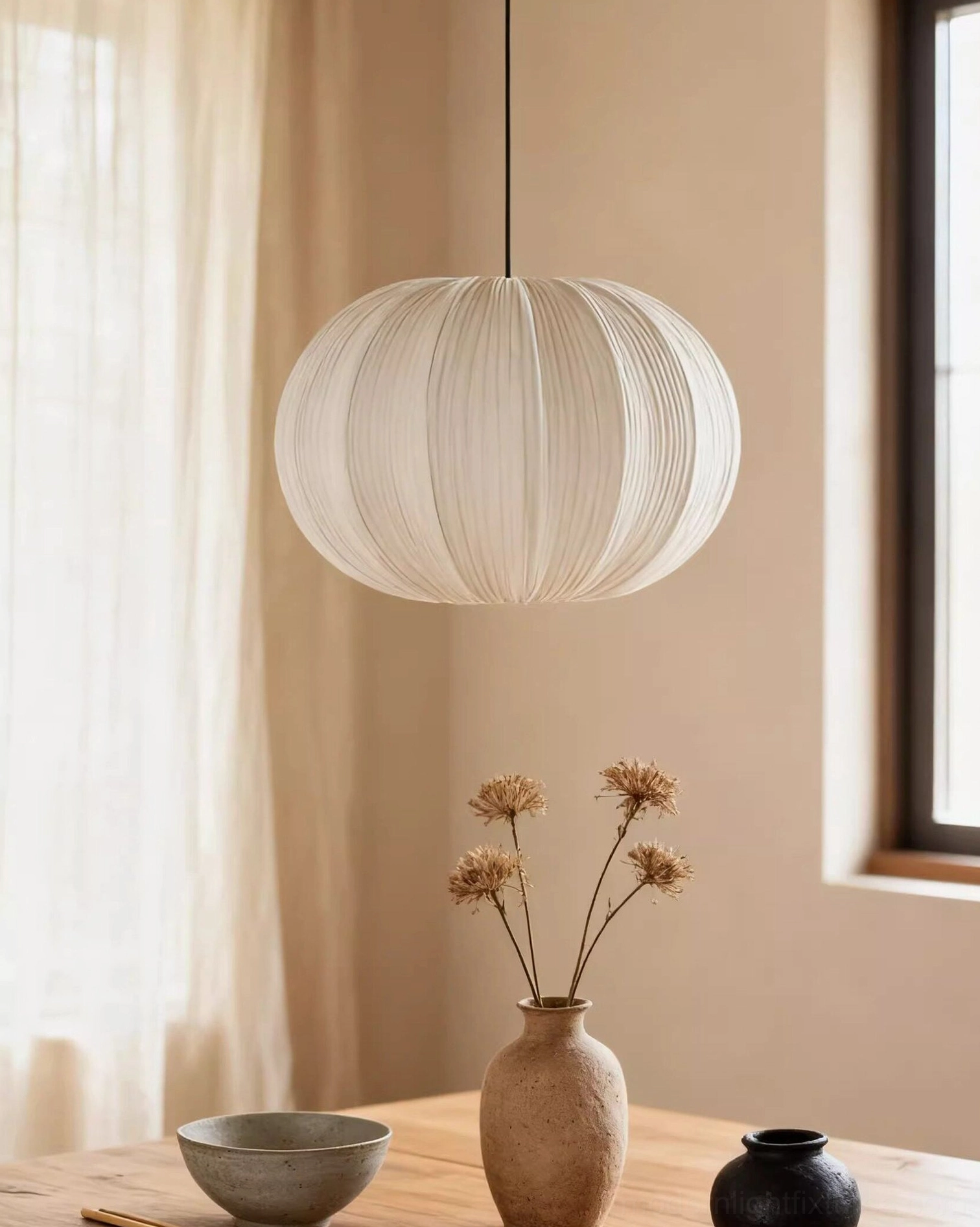 Multiple Elunor teardrop pendant lights clustered at staggered heights along hallway or stairwell
