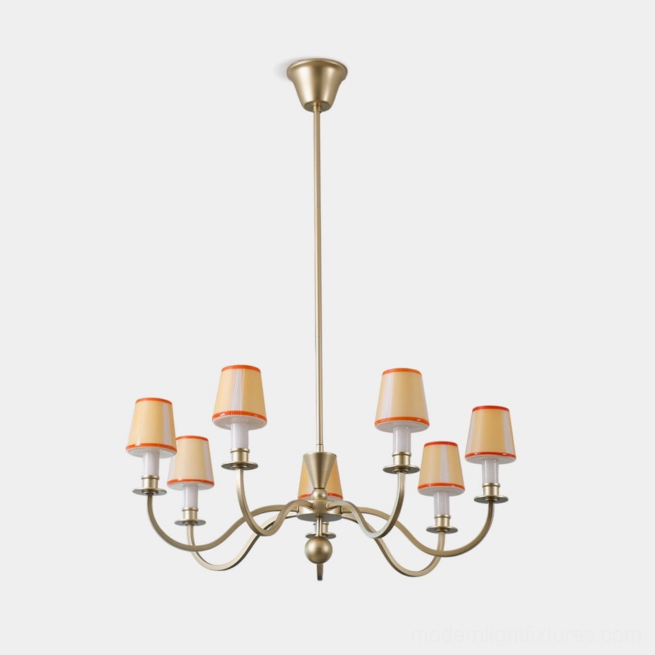 Elviera mid-century modern chandelier with 6 golden curved arms and orange-trimmed glass shades, studio overhead view