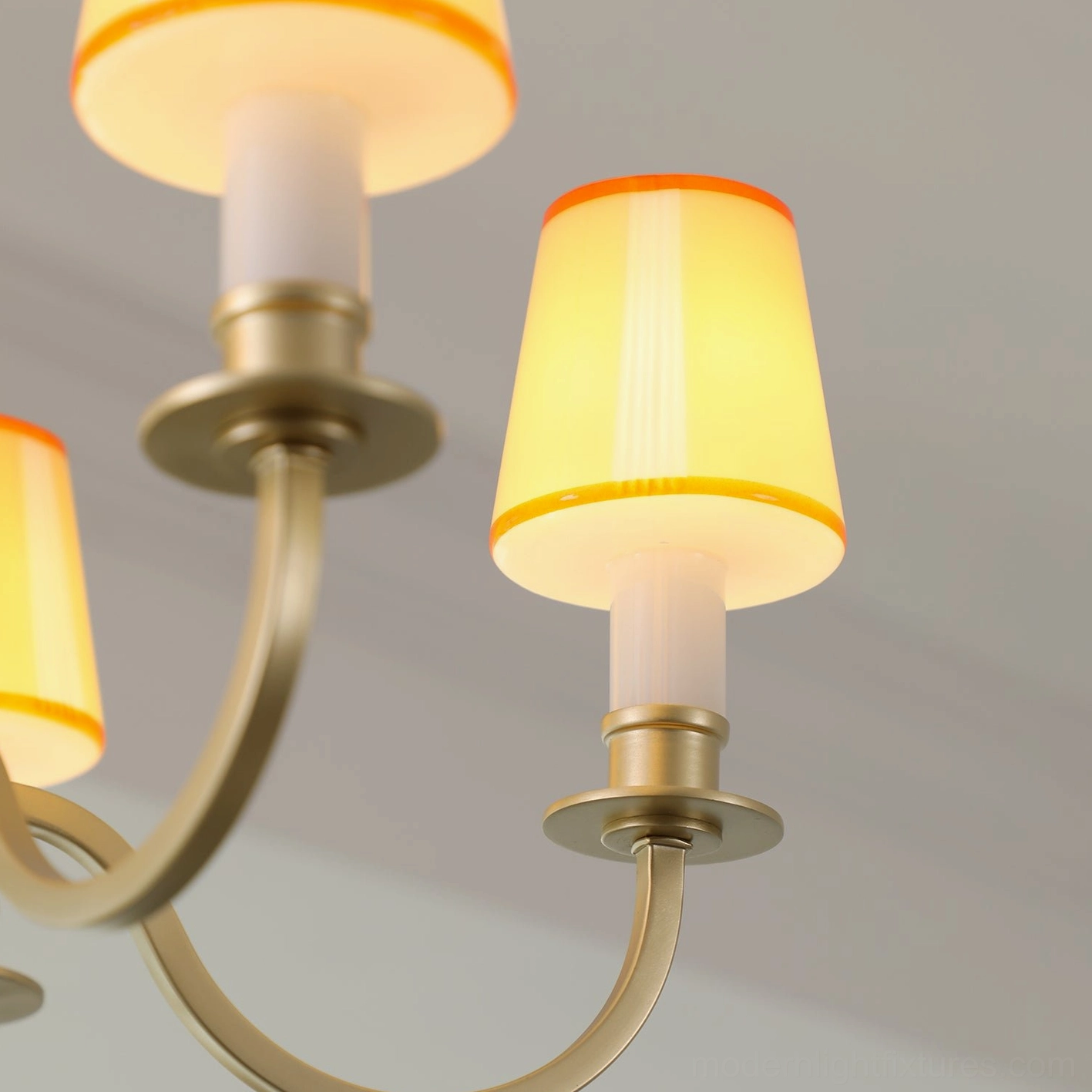 Elviera brass chandelier artistic overhead perspective showing sculptural curved arm design