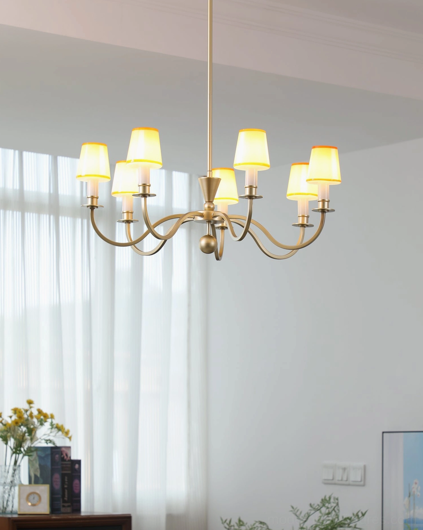 Elviera brushed gold chandelier with warm glowing shades, traditional farmhouse style living room