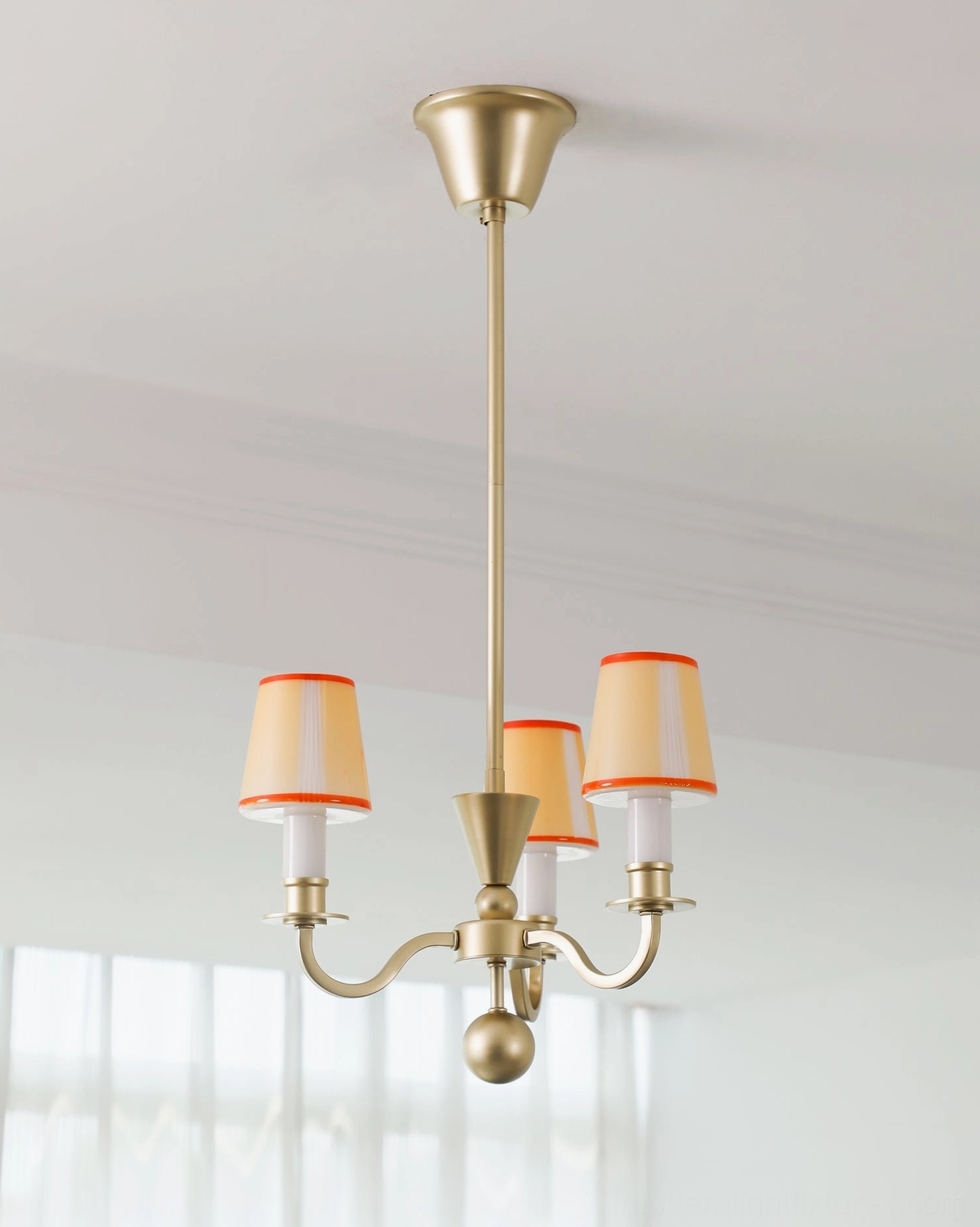 Elviera chandelier glass shade close-up showing orange trim accent and warm diffusion