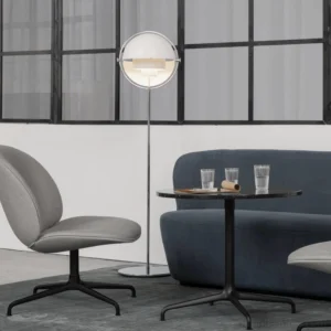 Transparent globe Elvira floor lamp with black metal pole and frosted clear lampshade in Nordic minimalist living room with warm ambient lighting