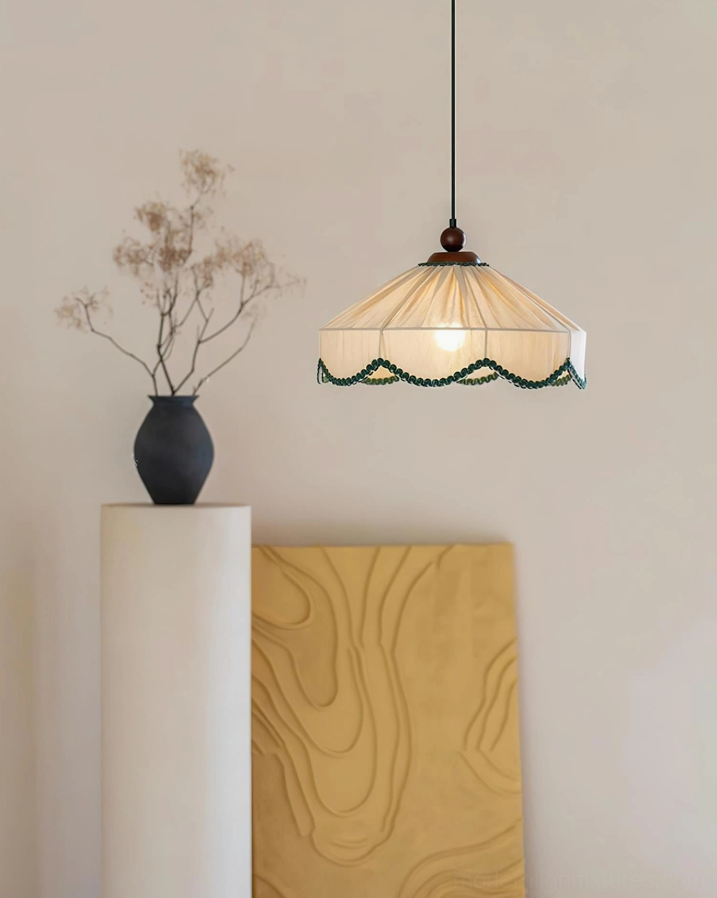 Elysia pendant lamp illuminated hanging view showing warm diffused light through pleated fabric
