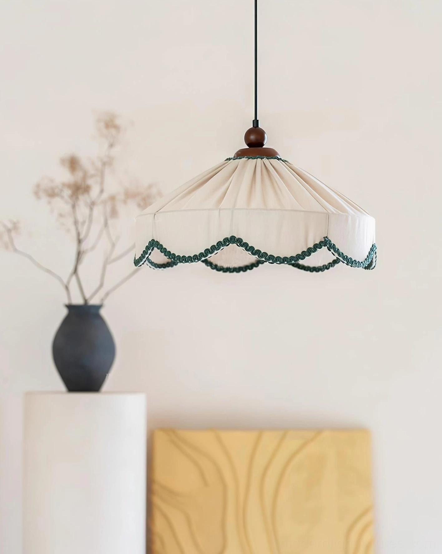 Elysia pendant lamp upper right side angle showcasing pleated fabric construction and decorative trim