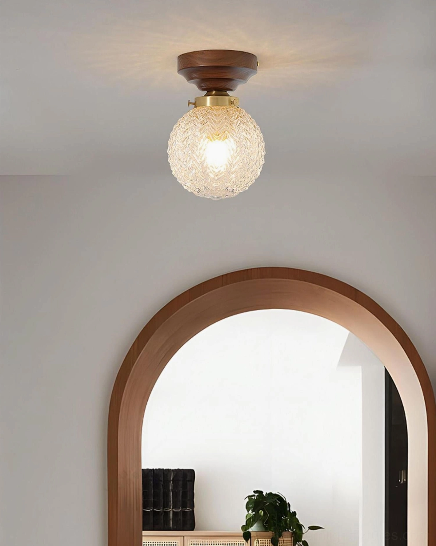 Vintage modern flush mount ceiling lamp with embossed glass globe and warm wood canopy, studio product shot