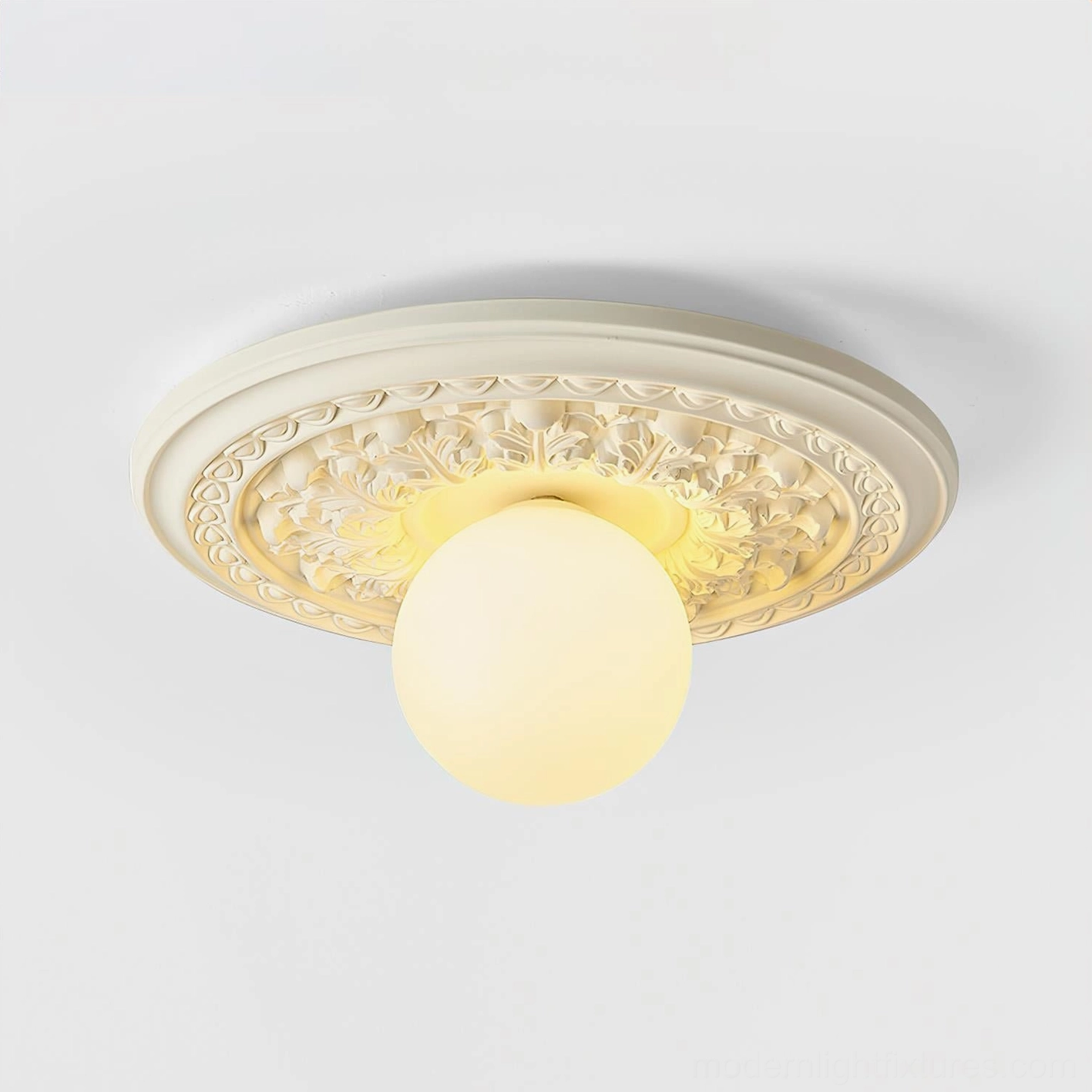 Contemporary flush-mount ceiling light with embossed resin base and warm glowing spherical shade