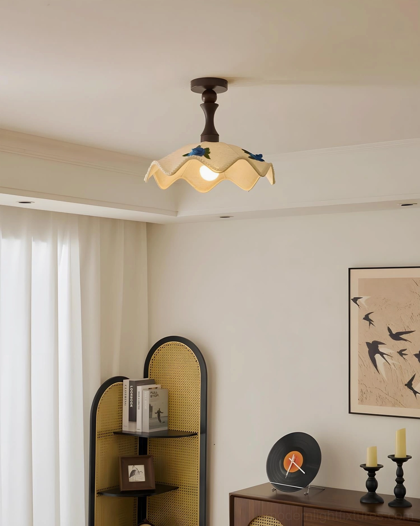 Close-up detail of wavy ceiling lamp shade showing fabric texture, hand-embroidered floral accents, and scalloped edge construction