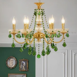 Lit emerald green crystal chandelier in elegant European-style living room with gold metal arms and green crystal pendants