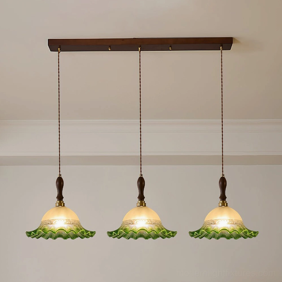 Emerald green hand-blown pendant light with scalloped frosted glass shade