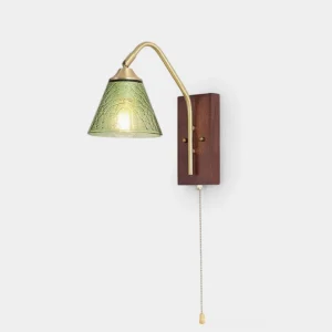 Emerald Grove vintage wall sconce with textured green glass shade and brass curved arm on walnut wood base, studio front view