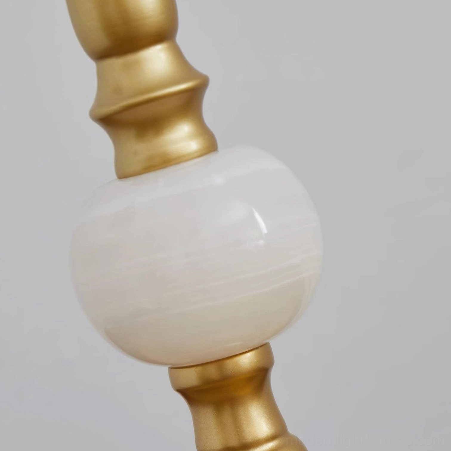 Emerald green velvet luxury table lamp with gold base tassel and jade stone embellishments showcase