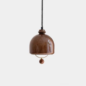 Enda mid-century modern glass dome pendant light with wooden ball accent and brass ring detail, front close-up view