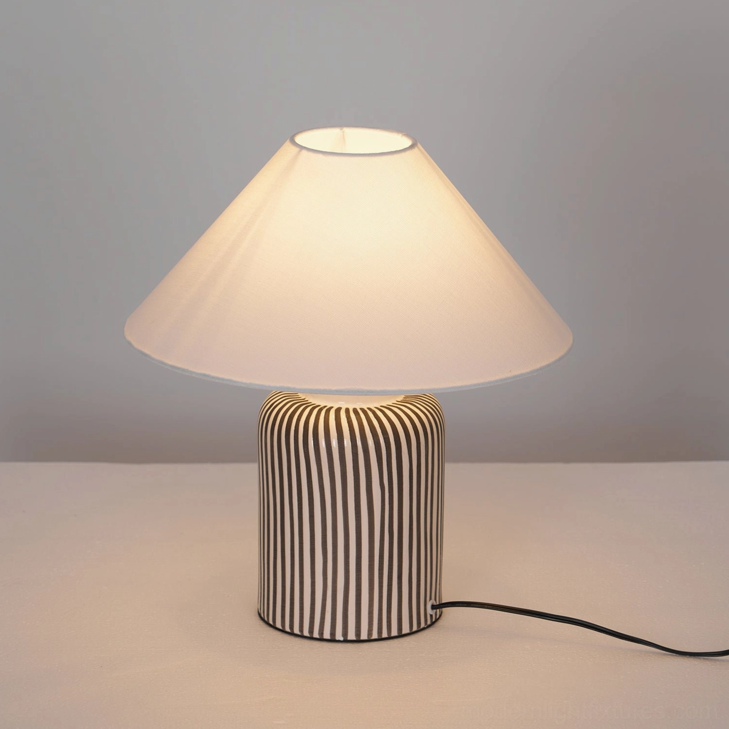 Striped ceramic table lamp with 40W incandescent or LED bulb accommodation for energy efficiency