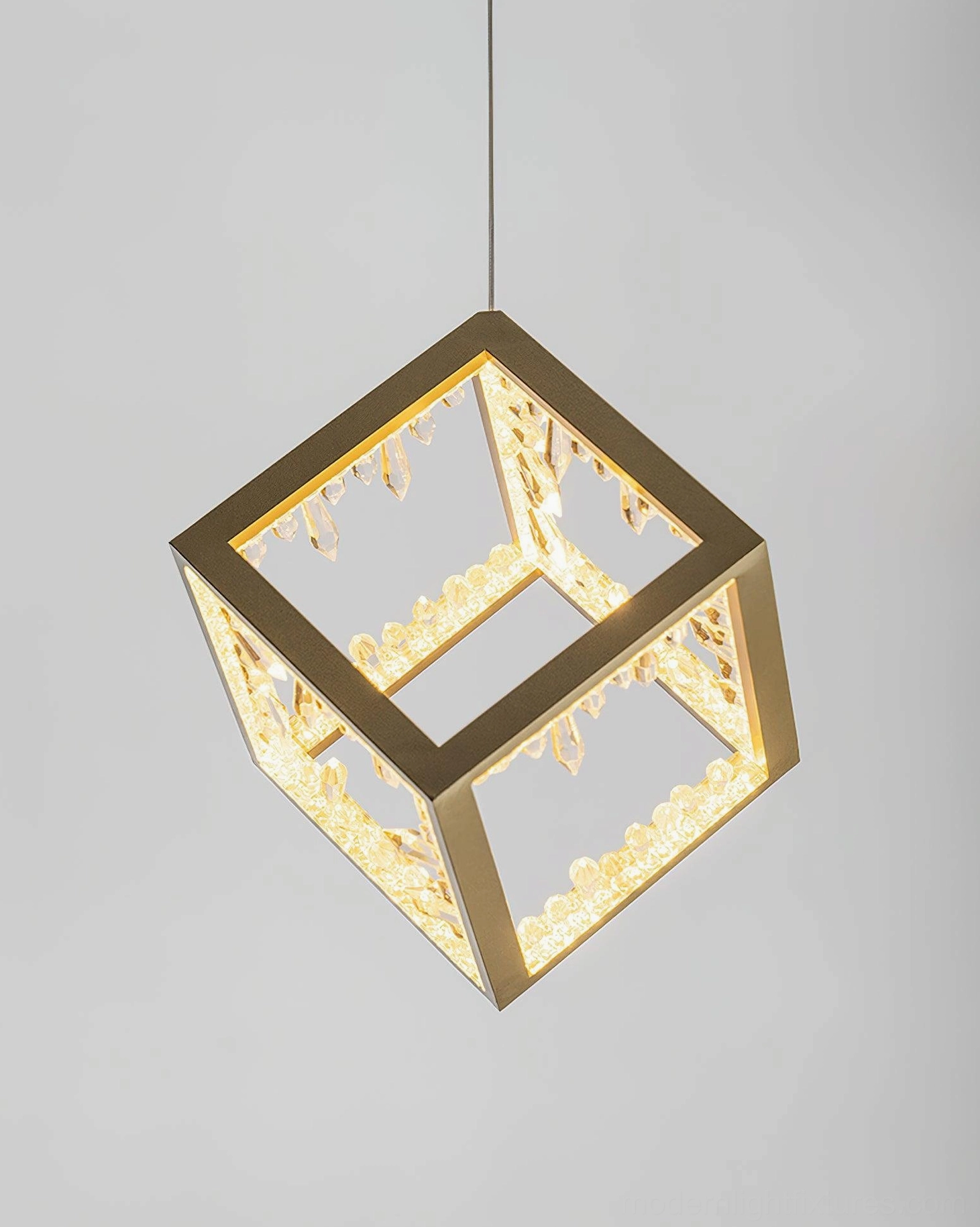 Gold frame cube pendant lamp with engraved translucent crystal panels warm glow effect