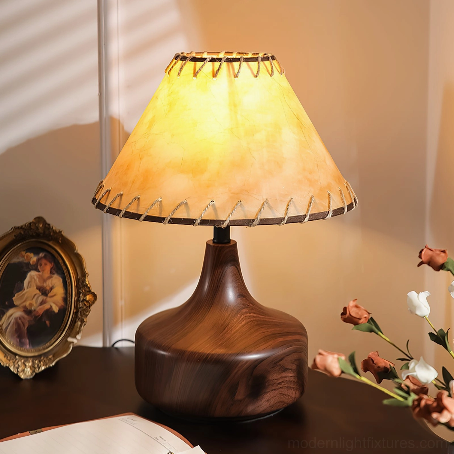 Enora vintage table lamp on desk with hand-stitched parchment shade detail