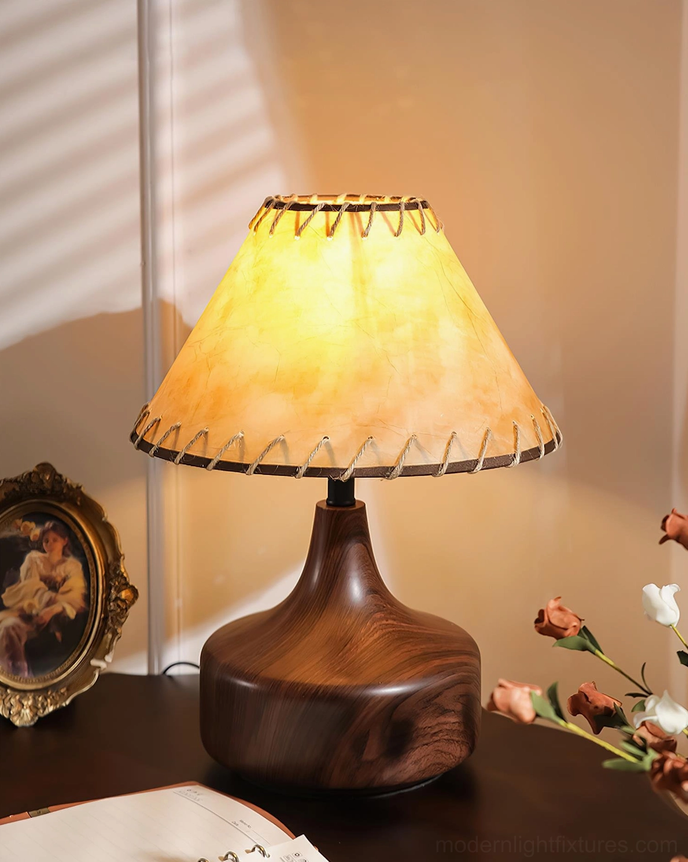Enora table lamp creating warm ambient lighting in mid-century interior