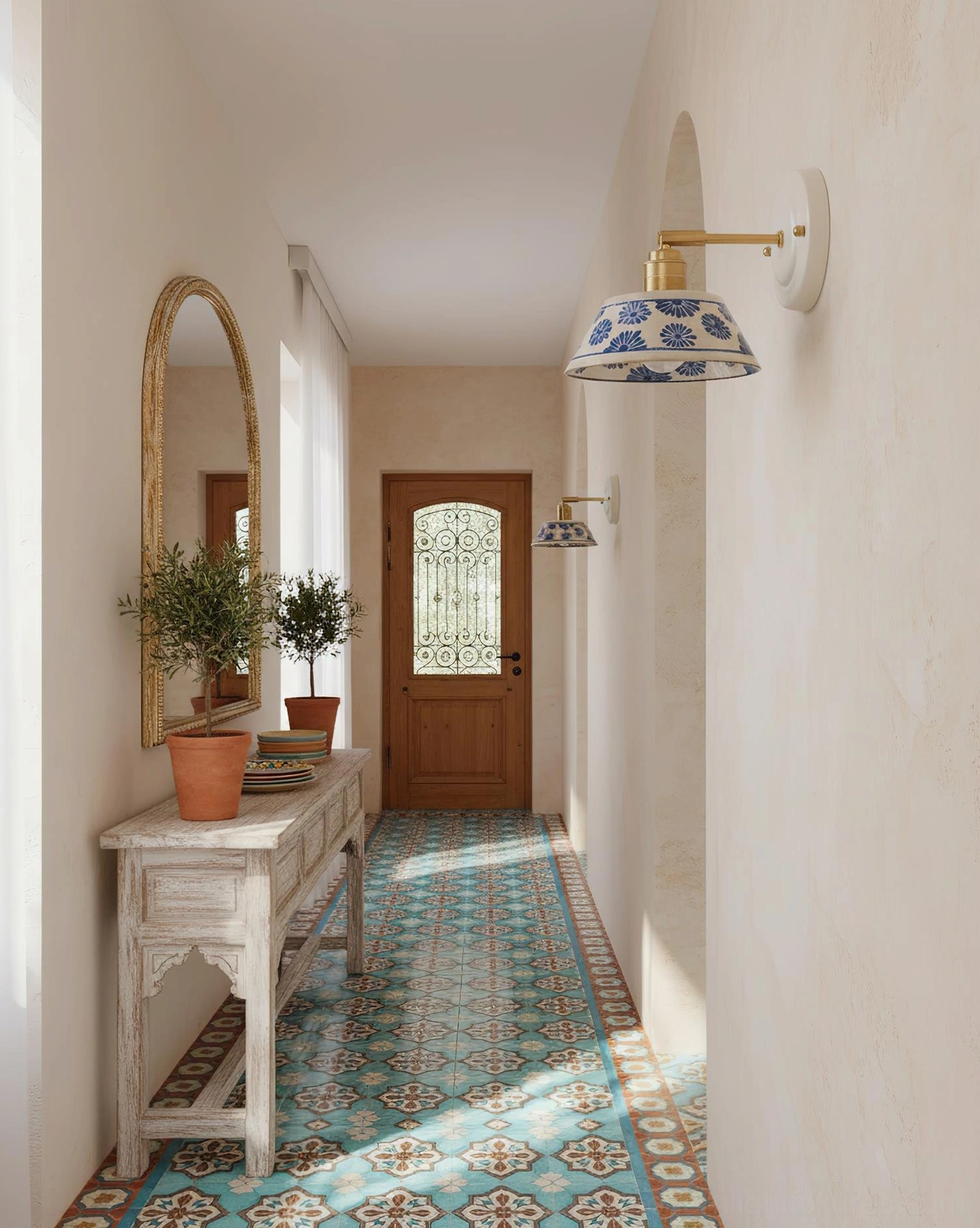 Ceramic wall sconce lighting hallway entry with arch mirror and botanical decor