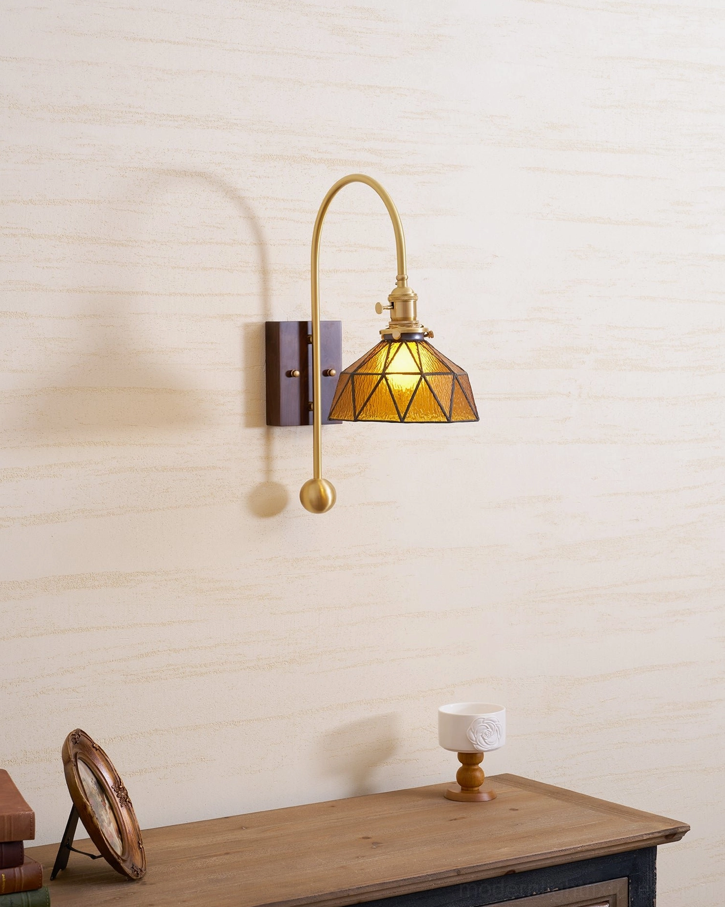 Entryway wall sconce creating welcoming first impression with warm directional light
