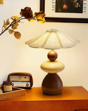 Equinox table lamp illuminated on vintage dresser with retro radio - warm ambient lighting