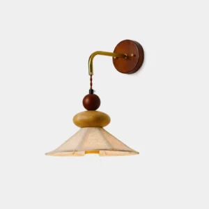 Equinox wooden wall sconce with pleated linen shade, front view on white background showcasing sculptural wood frame and warm fabric diffuser