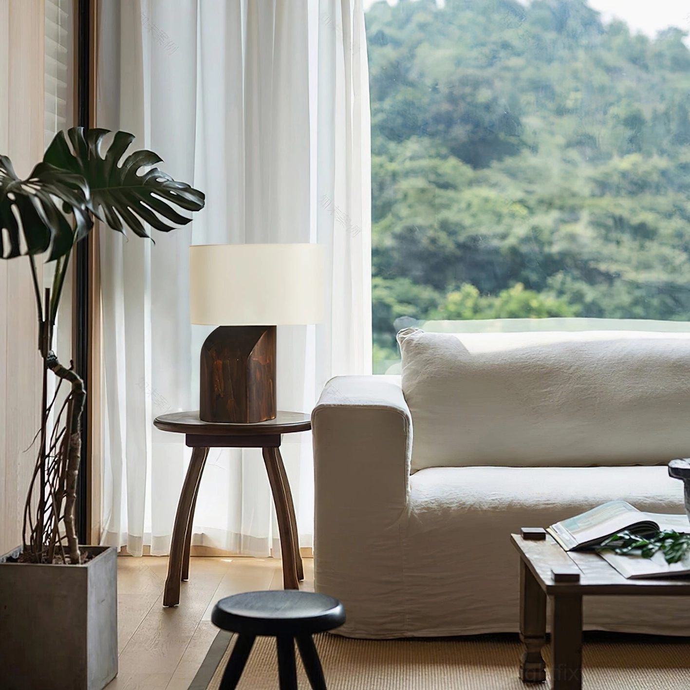Contemporary wood table lamp in living room boho interior with sofa, cozy accent lighting in daylight