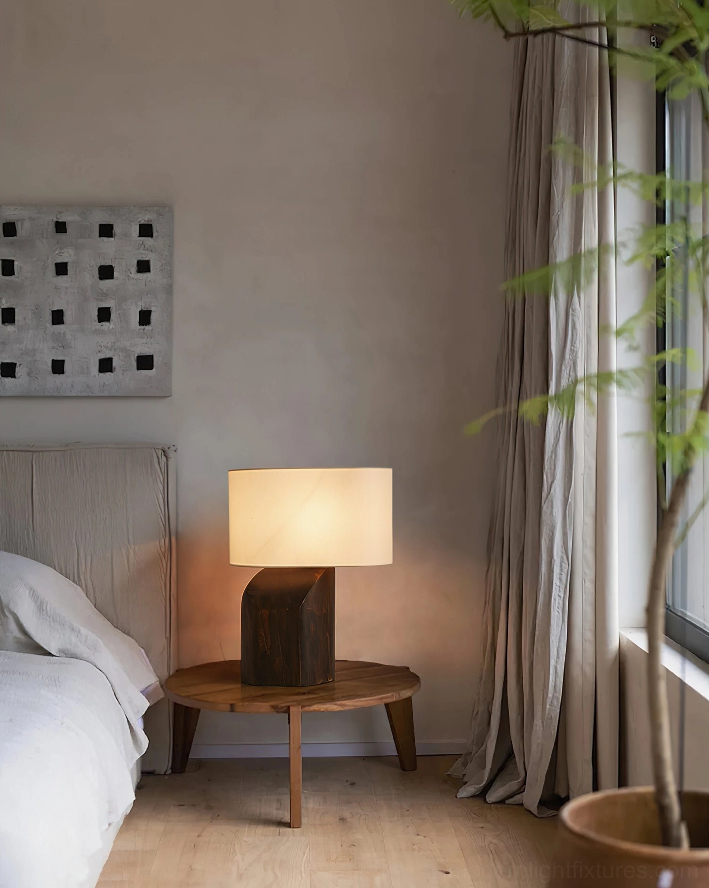 Esla minimalist lamp on small round wooden table in neutral bedroom, wabi-sabi interior styling