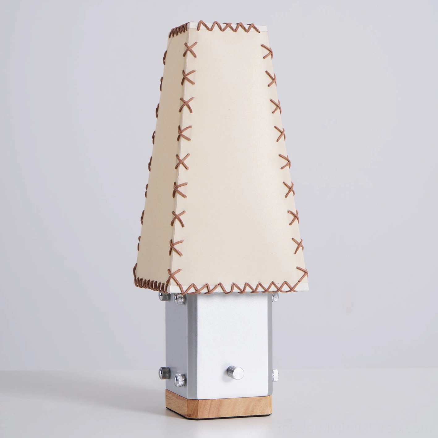Estela handcrafted table lamp close-up showing quality stitching and parchment fabric shade