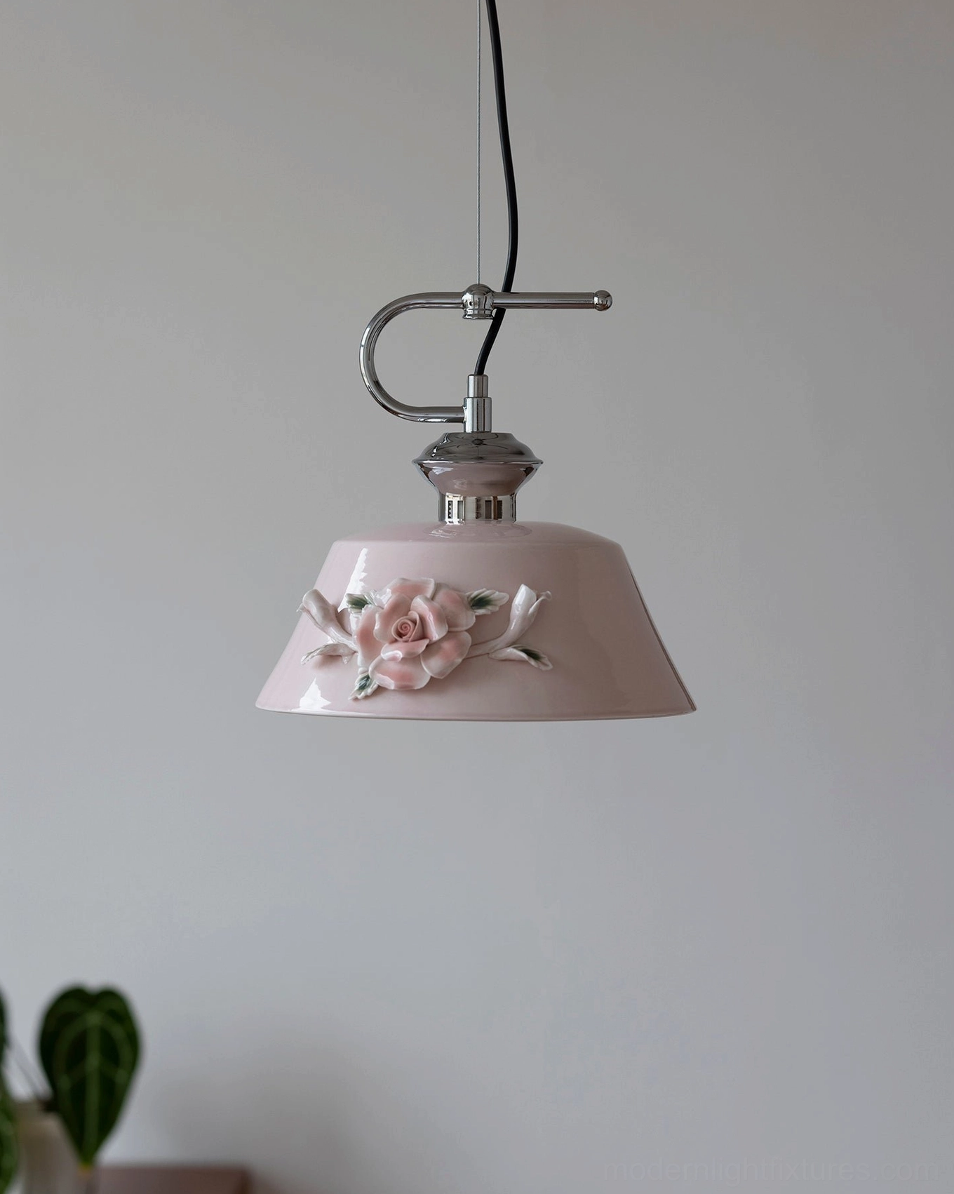 Evelisse pale pink ceramic pendant light with sculptured flower detail and chrome hardware, fresh botanical interior styling with green plants