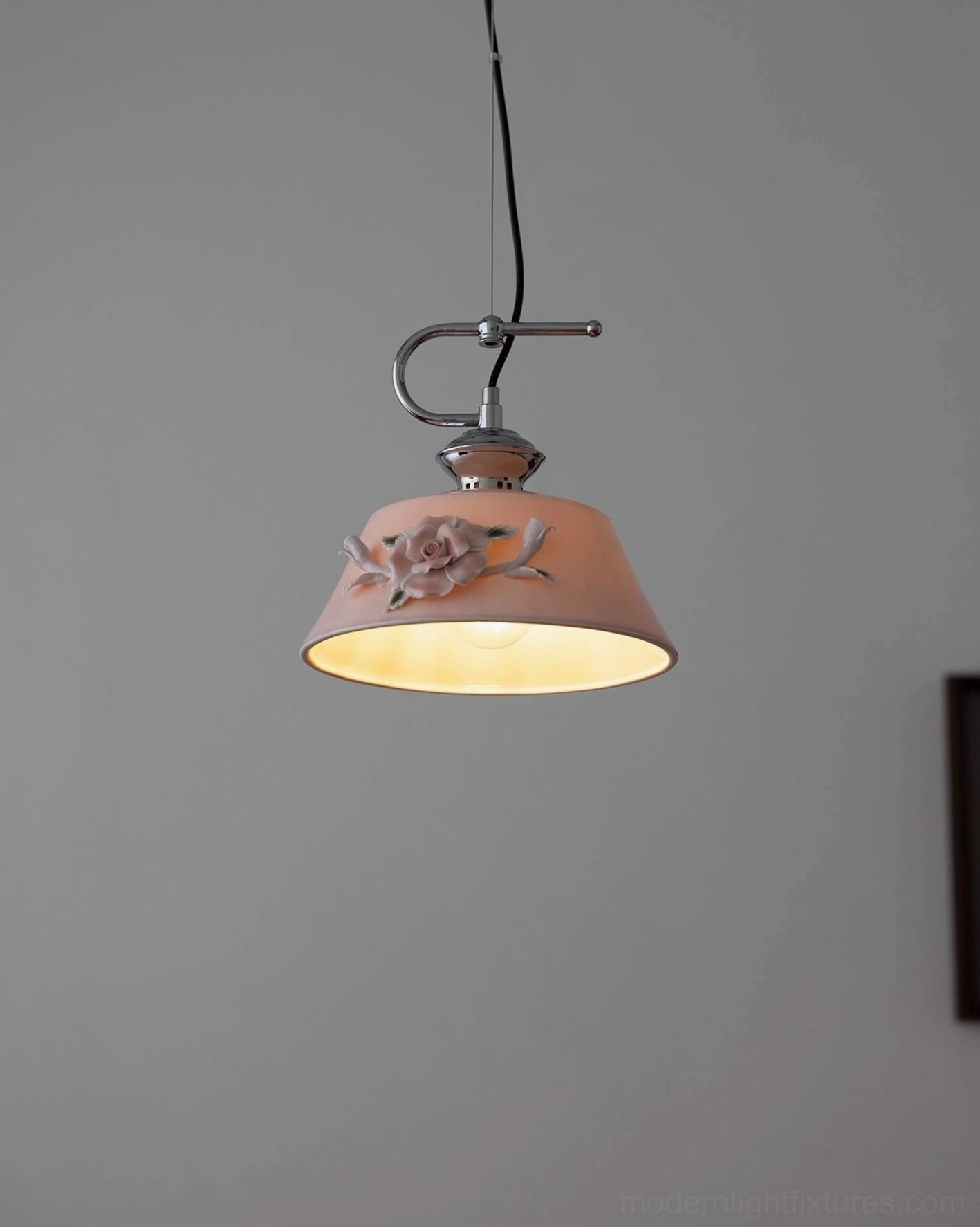 Evelisse ceramic pendant fixture showing camellia bloom sculptural detail and light transmission through glazed shade
