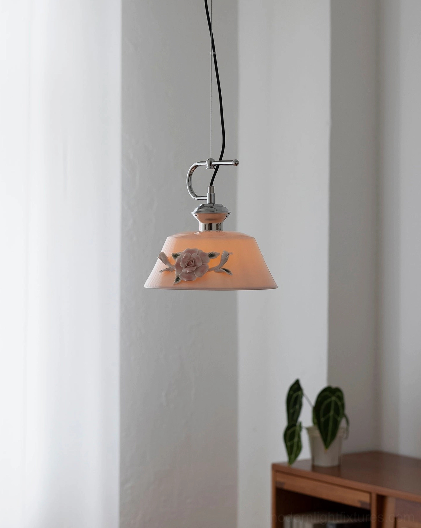 Evelisse ceramic pendant light ambient lighting effect with warm glow and shadow play from sculptured camellia decoration