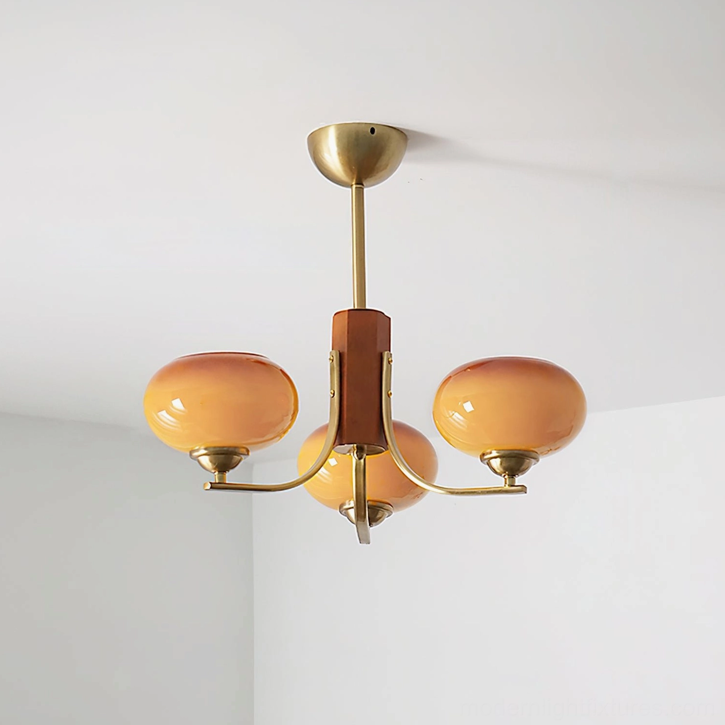 Fabio 3-head copper and caramel chandelier side view showing brass frame and wood column
