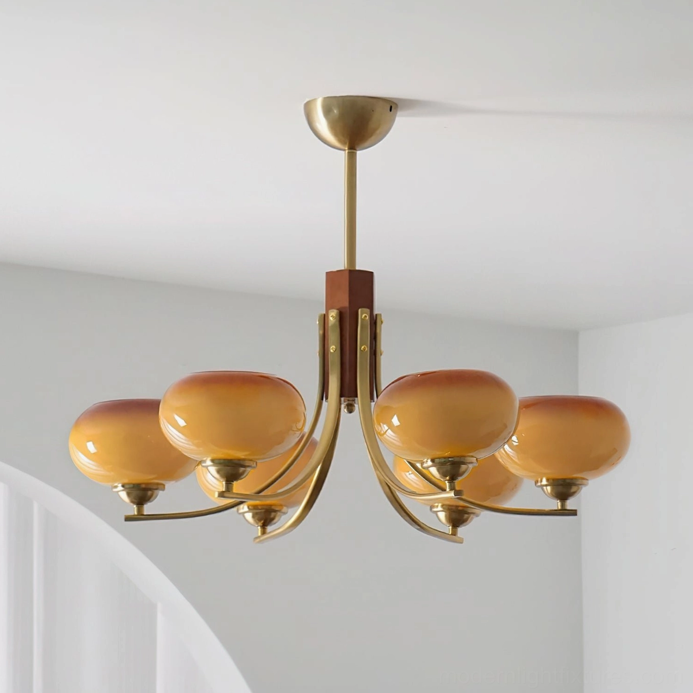 Fabio 6-head chandelier caramel color option showing warm metallic finish and glass globe shades