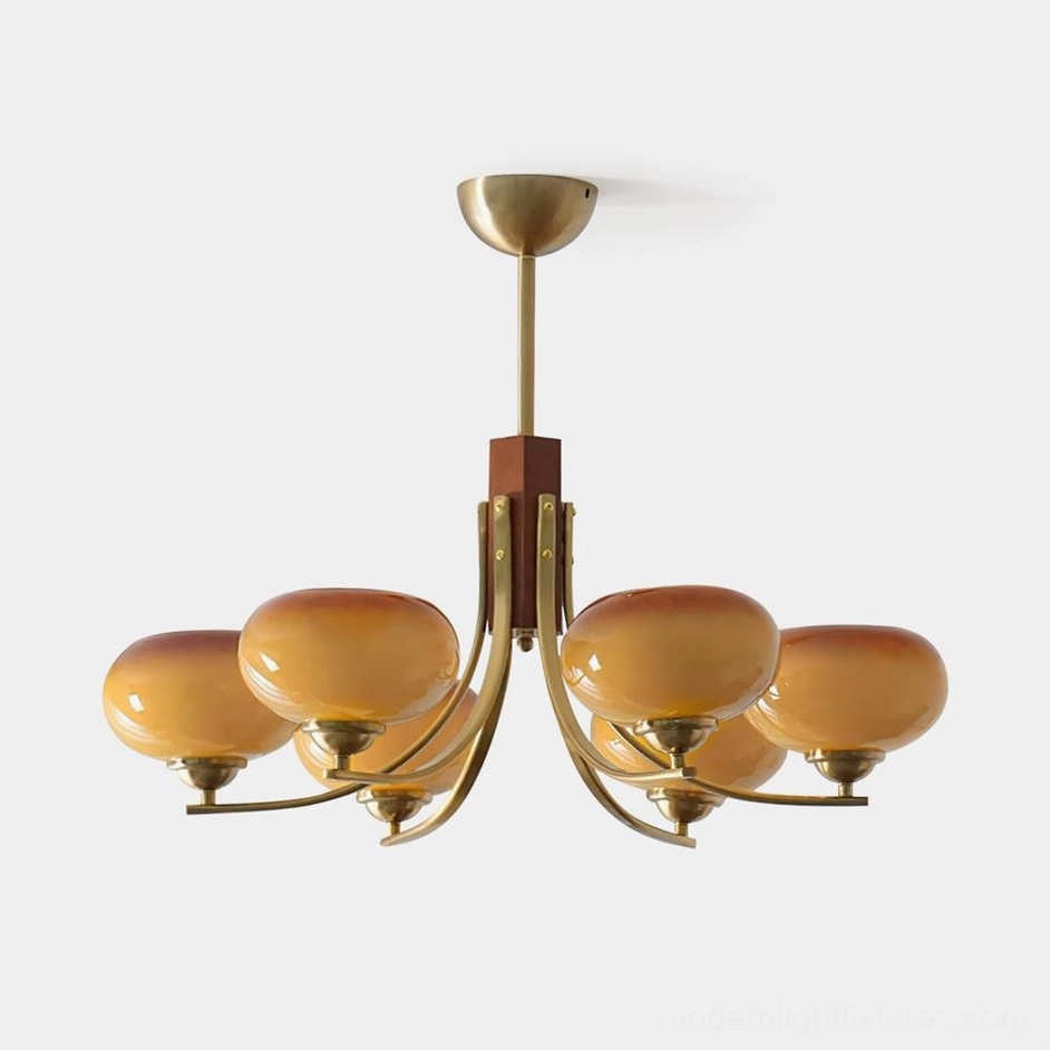 Fabio mid-century 6-light chandelier with copper brass frame and amber glass shades on white studio background