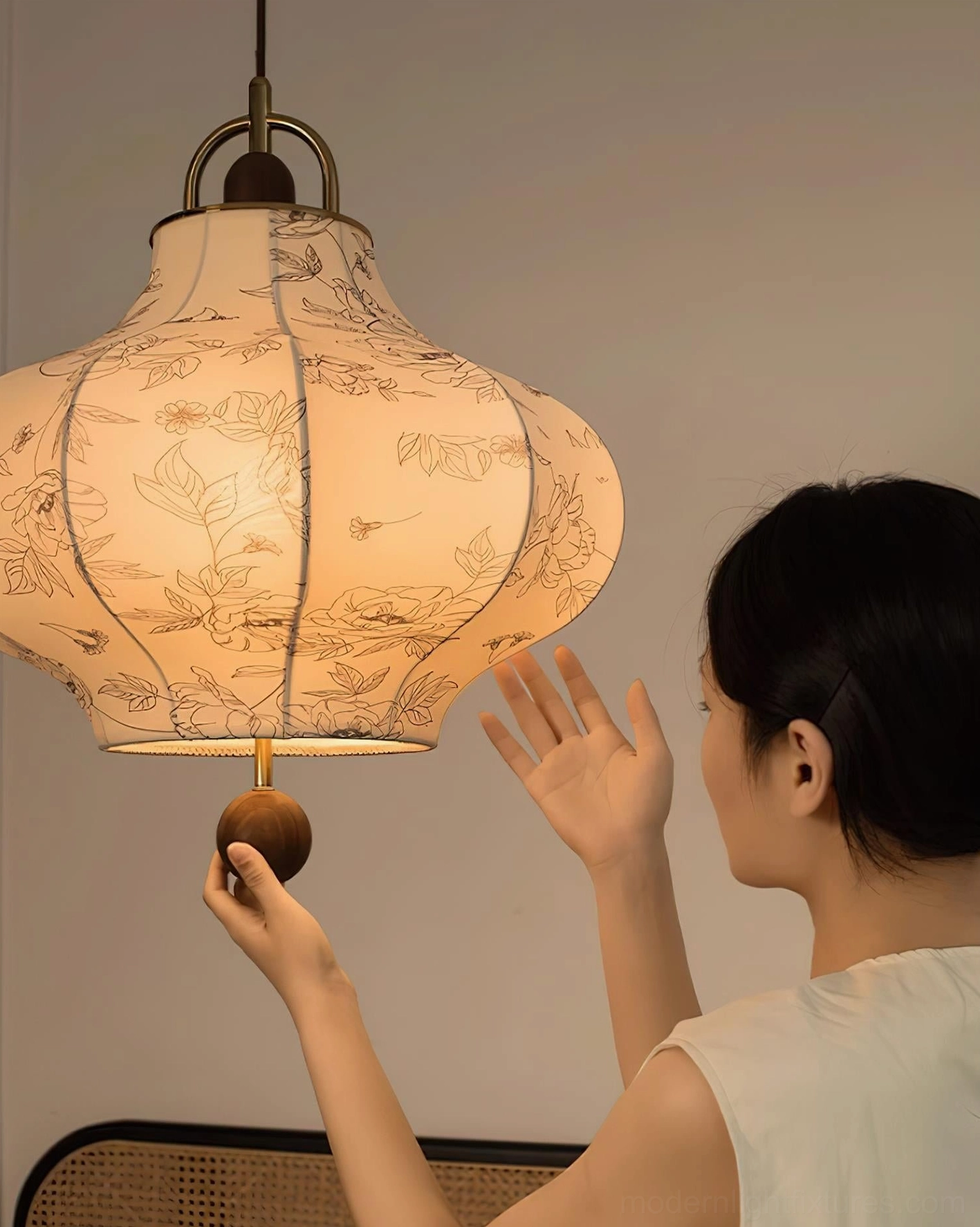 Fabric pendant lamp with brass top hardware and floral botanical motifs