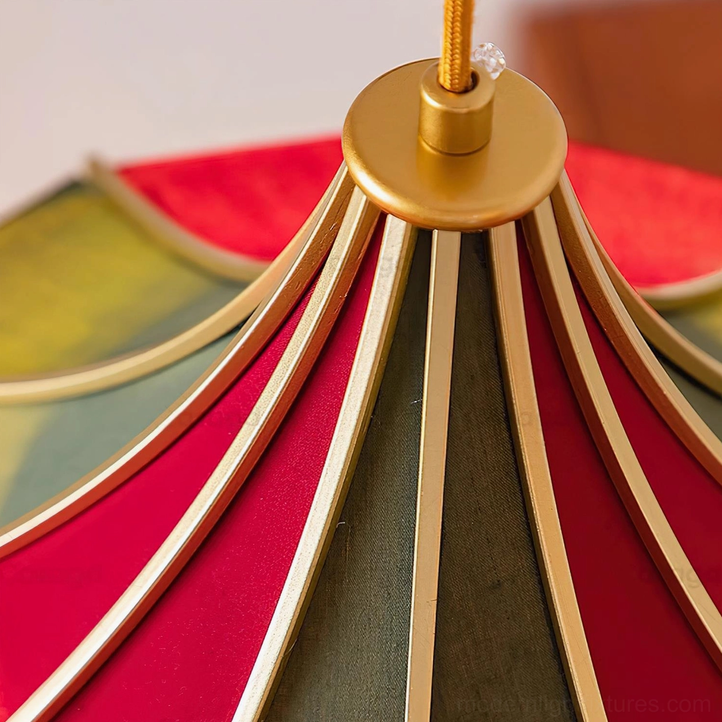 Gold metal fixture and ceiling mounting hardware of circus-inspired scalloped fabric pendant lamp