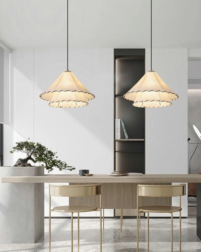 Pair of beige fabric pendant lamps above modern dining bar with minimalist japandi aesthetic and natural lighting