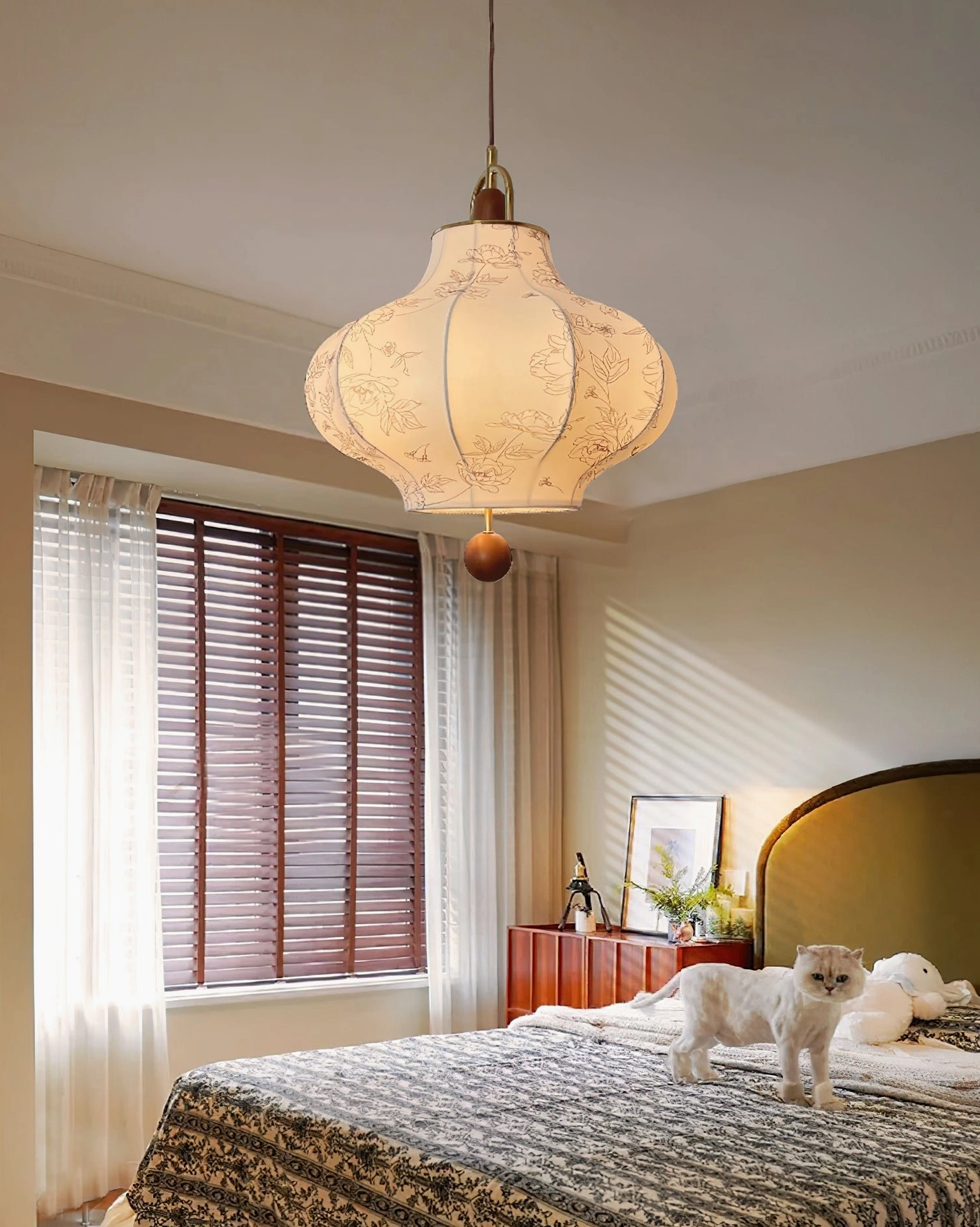 Fabric pendant lamp with floral patterns in bedroom warm lighting ambiance