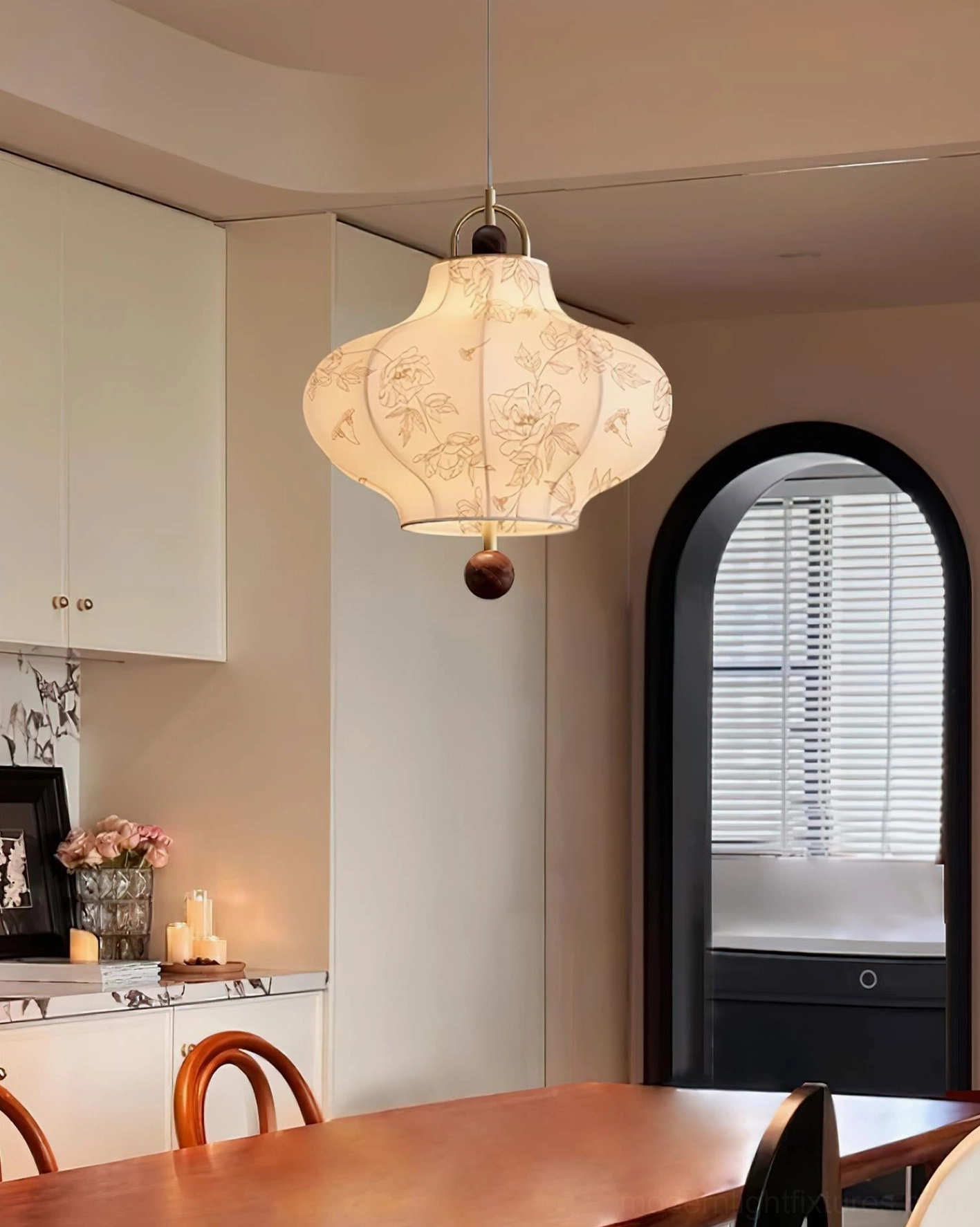 Fabric pendant light above dining area retro home decor style warm glow